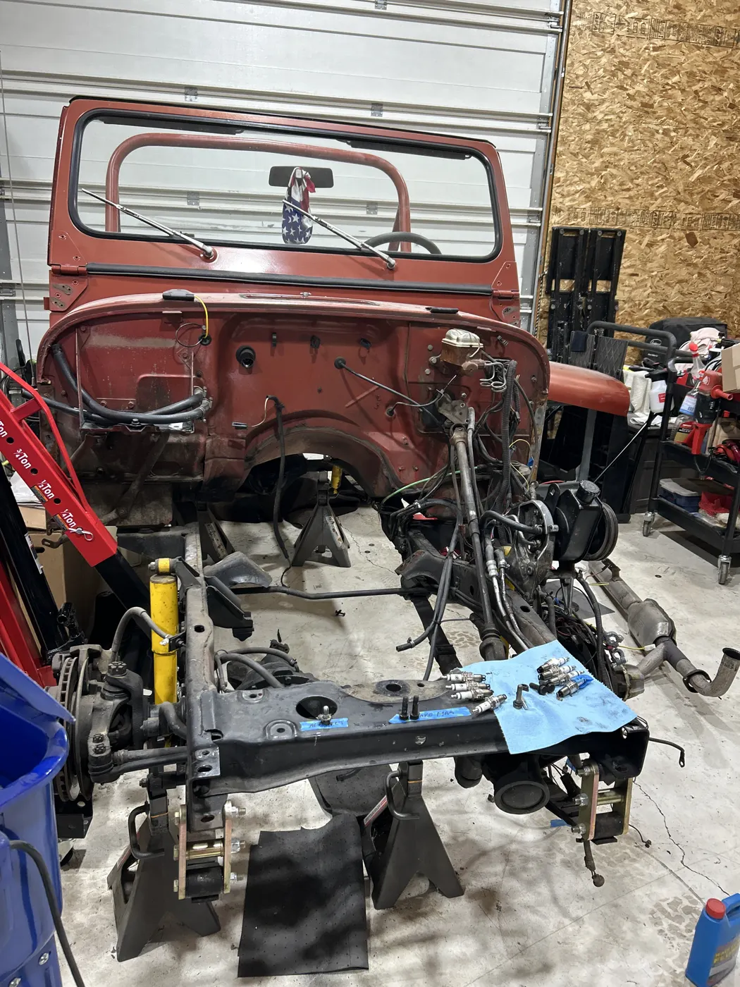 1979 Jeep CJ5 body on the frame during a teardown